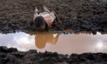A boy drinks water from a pond in Bule Duba village in the outskirts of Moyale, near the edge of Oroma and Somali regions of Ethiopia